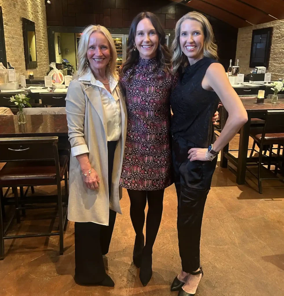 Ashley with two others at an event where she raised money for YLCI