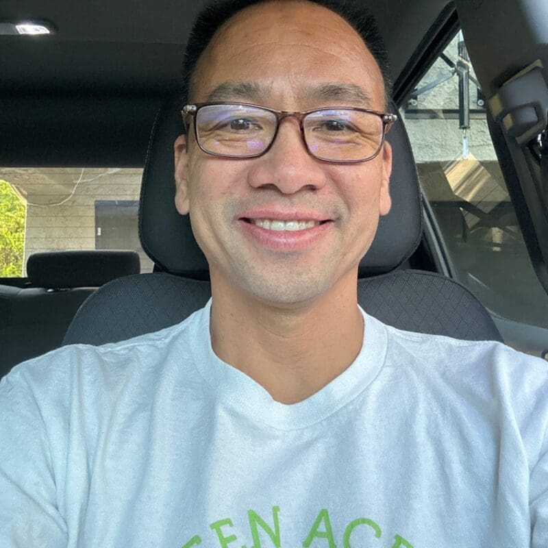 Thuan Dao, a lung cancer patient from California, smiles in his car.