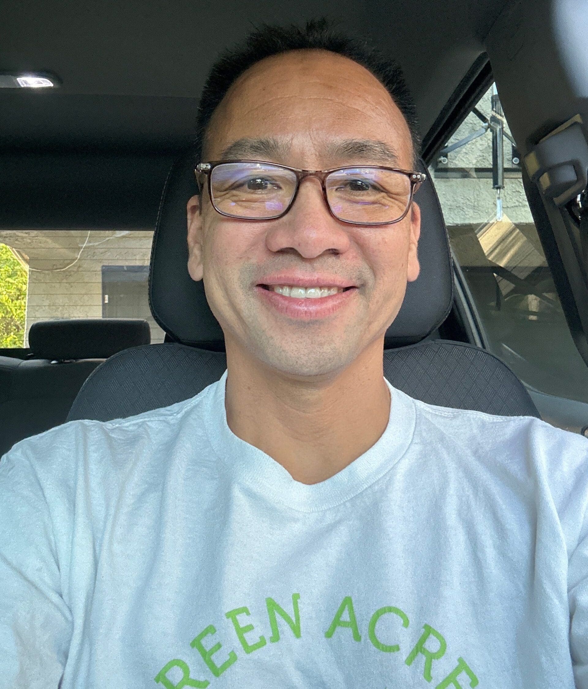 Thuan Dao, a lung cancer patient from California, smiles in his car.