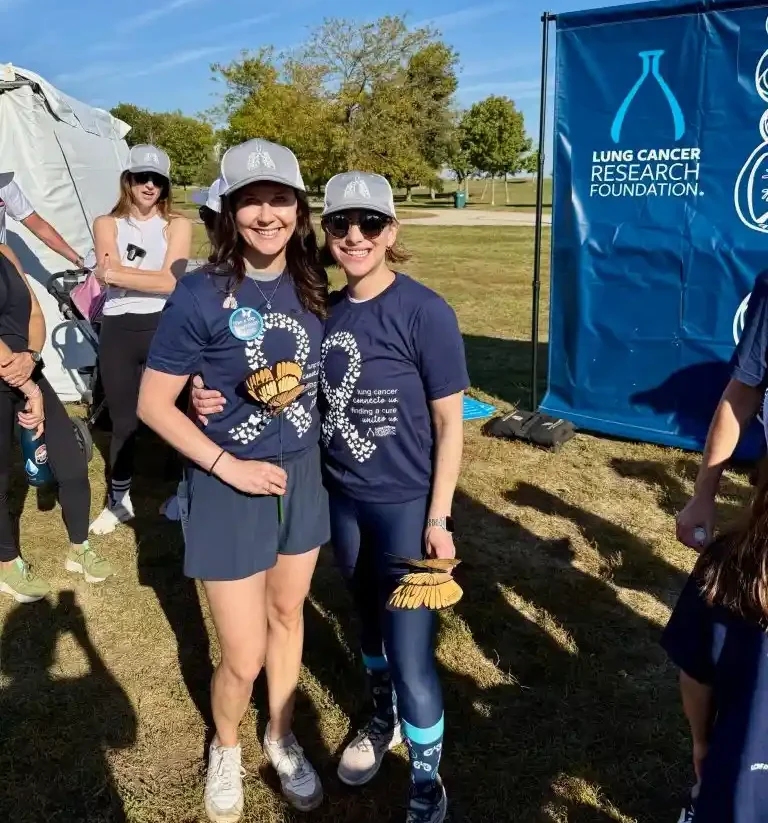 Young lung cancer community members Ashley and Lexi pose together at an LCRF event