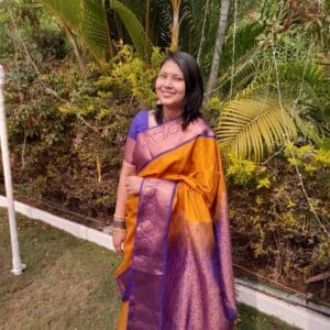 Suchismita, smiling, diagnosed with lung cancer at 22 in India.