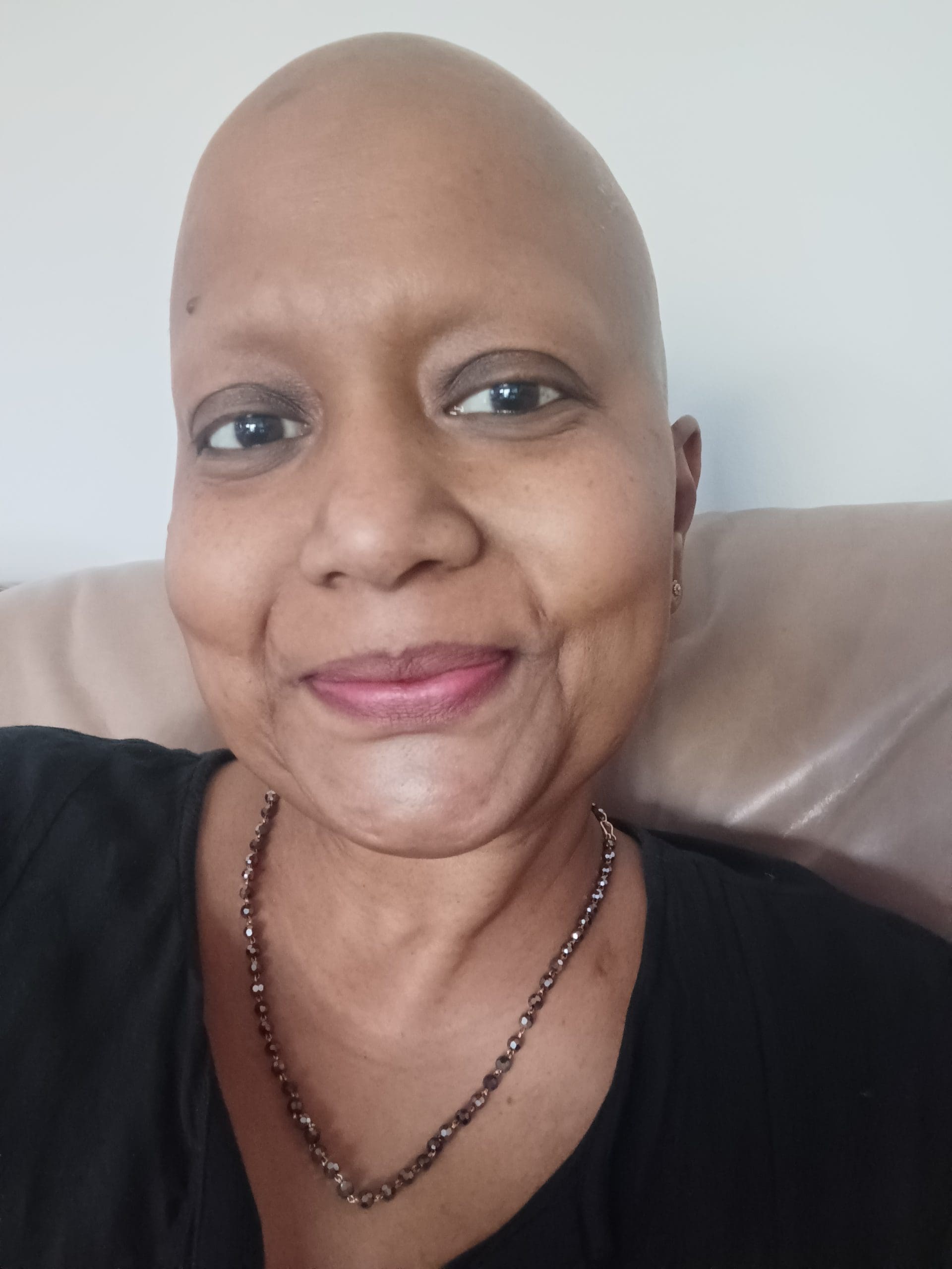 Tamara, a lung cancer patient from South Africa, smiles