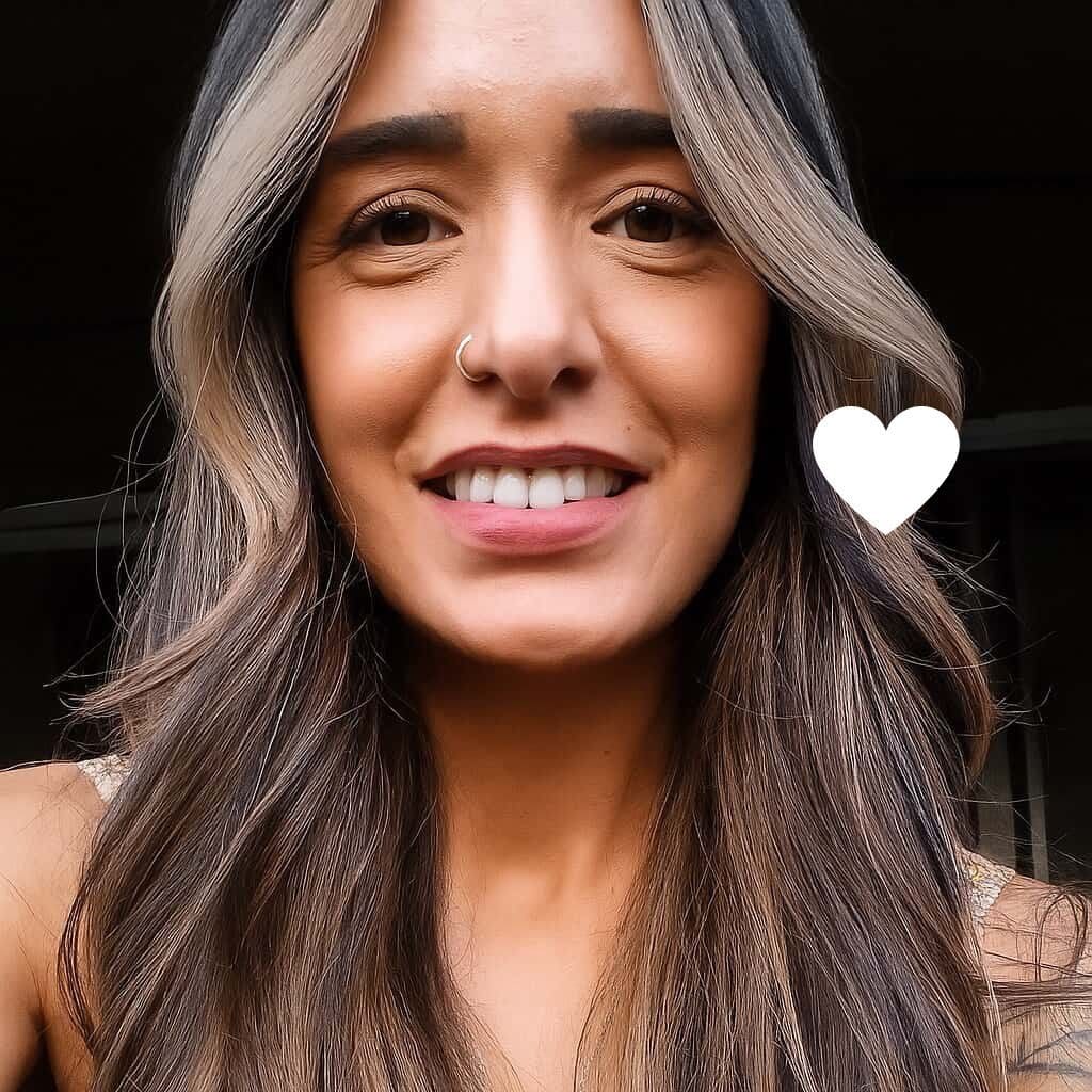 Linda, a young woman with lung cancer, smiles.