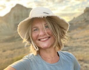 Noor, a lung cancer patient from the Netherlands, smiles outdoors