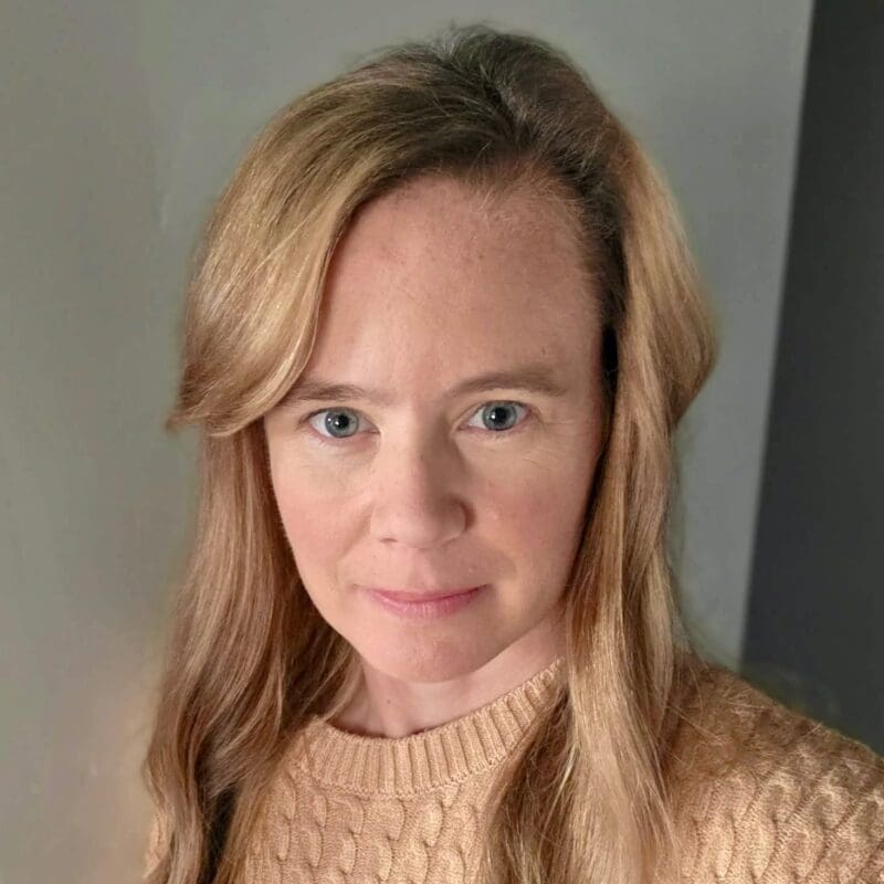 Samantha Murrell was diagnosed at 37 years old with HER2 exon 20 non small cell lung cancer. Headshot photo with a smirk