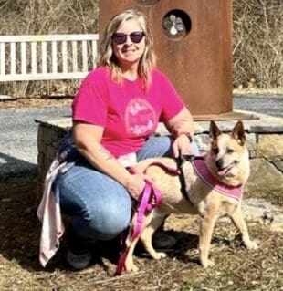 Lung cancer patient Amy posing with her dog
