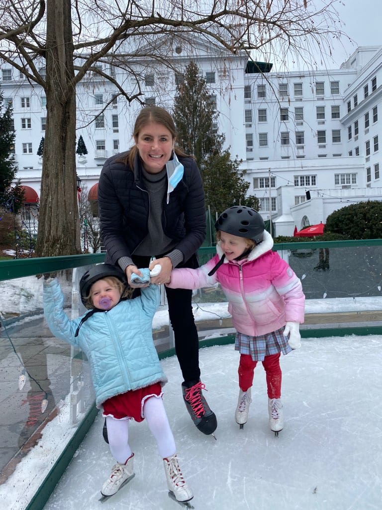 Elizabeth ice skating with her two daughters