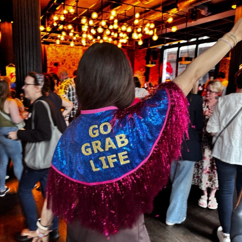 Patient advocate Yvonne Diaz in a Go Grab Life jacket at a Cancer in Common event