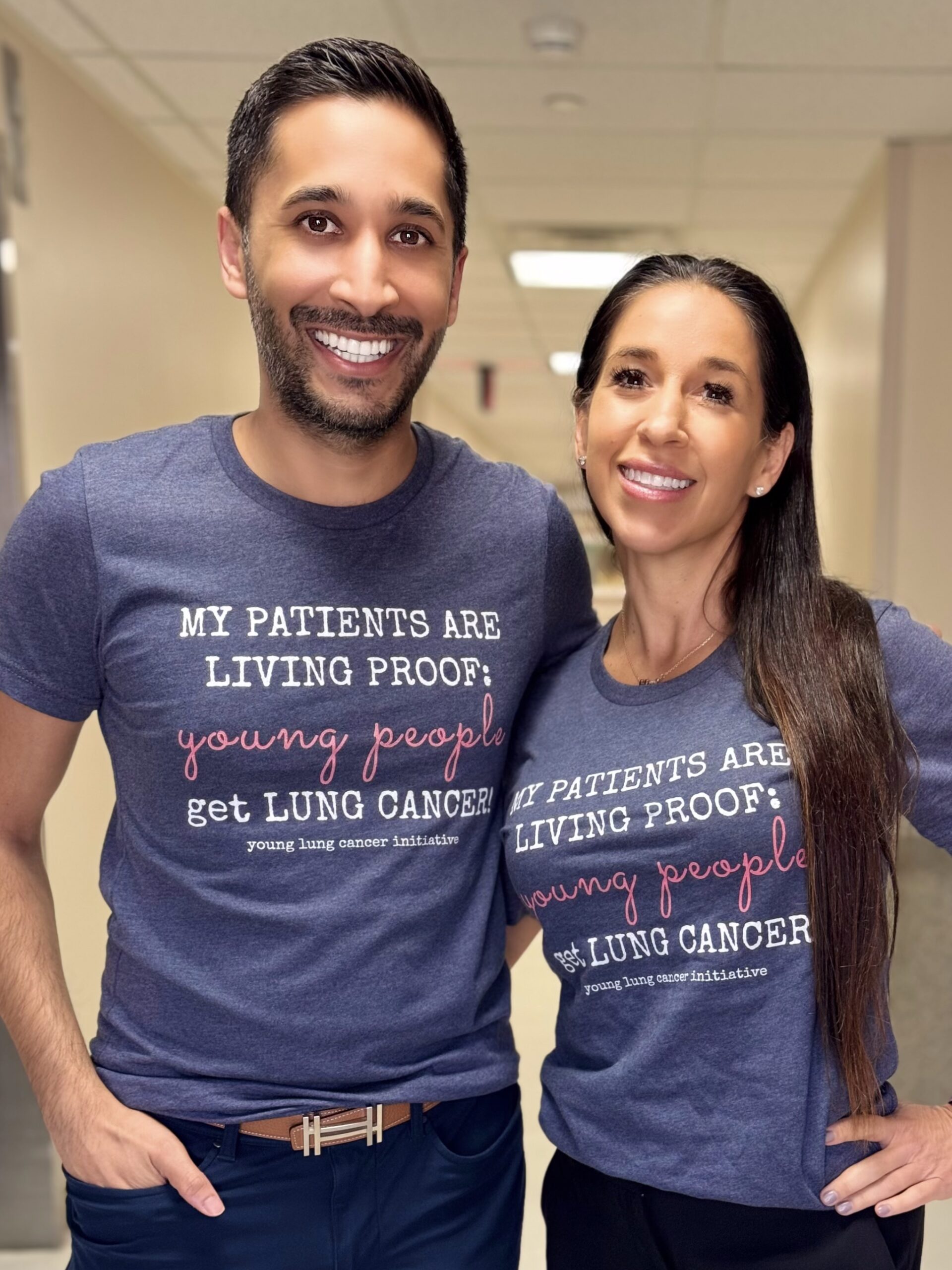 Thoracic oncologist Dr Eric Singhi and thoracic surgeon Dr Mara Antonoff smile together wearing YLCI t shirts