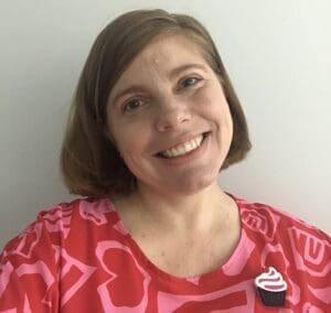 Stacey, a young woman with lung cancer from Australia, smiling.