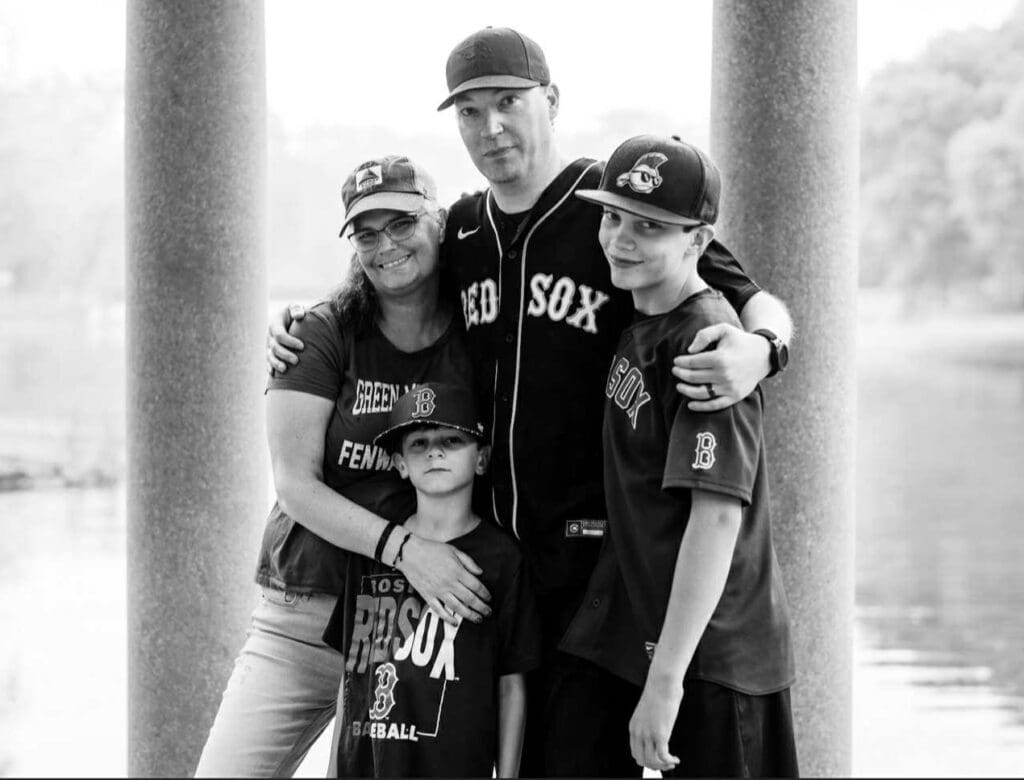 Theresa family posing in Red Sox black and white photo