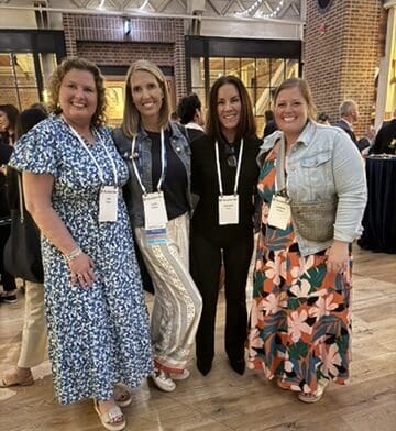 Patient advocates smile together indoors at ASCO 2026