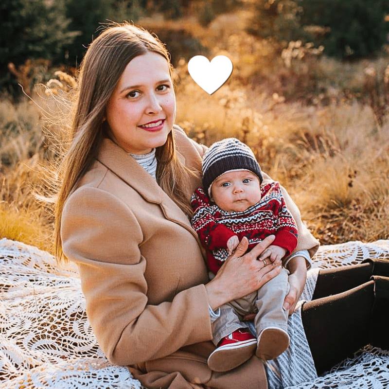 Kayla Thomas, young lung cancer community member. poses with newborn son