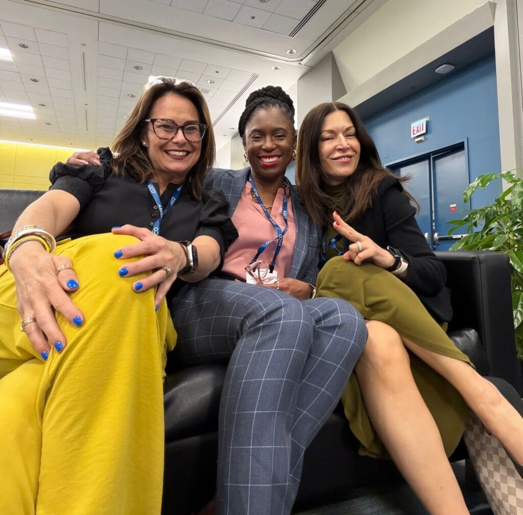 Three lung cancer advocates smiling at ASCO 2026