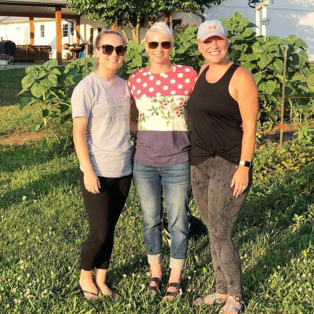 Illissa and her sisters together outdoors