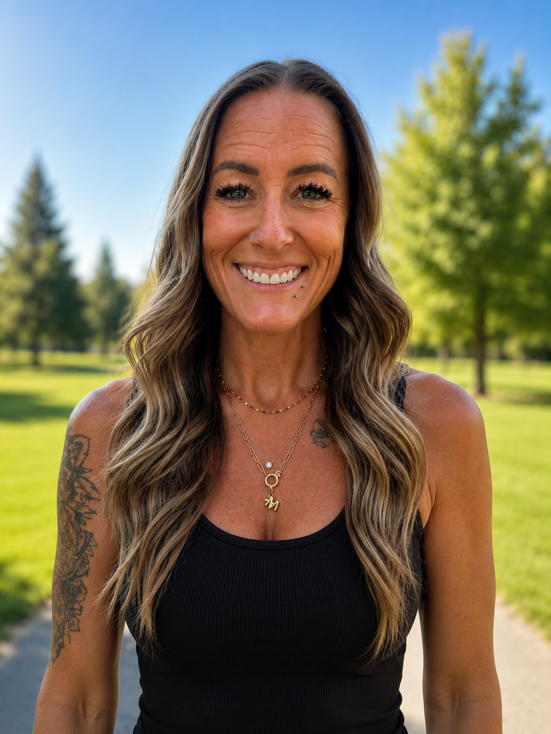 Young lung cancer patient smiles outdoors