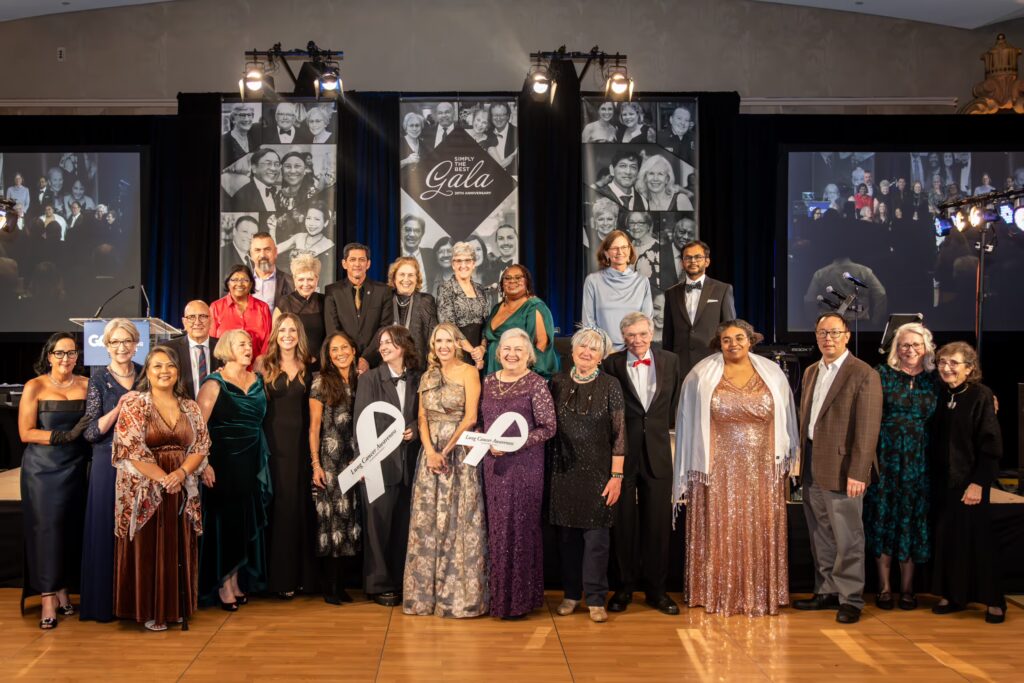 Group of lung cancer survivors in formal attire at the GO2 for Lung Cancer gala in San Francisco 2025