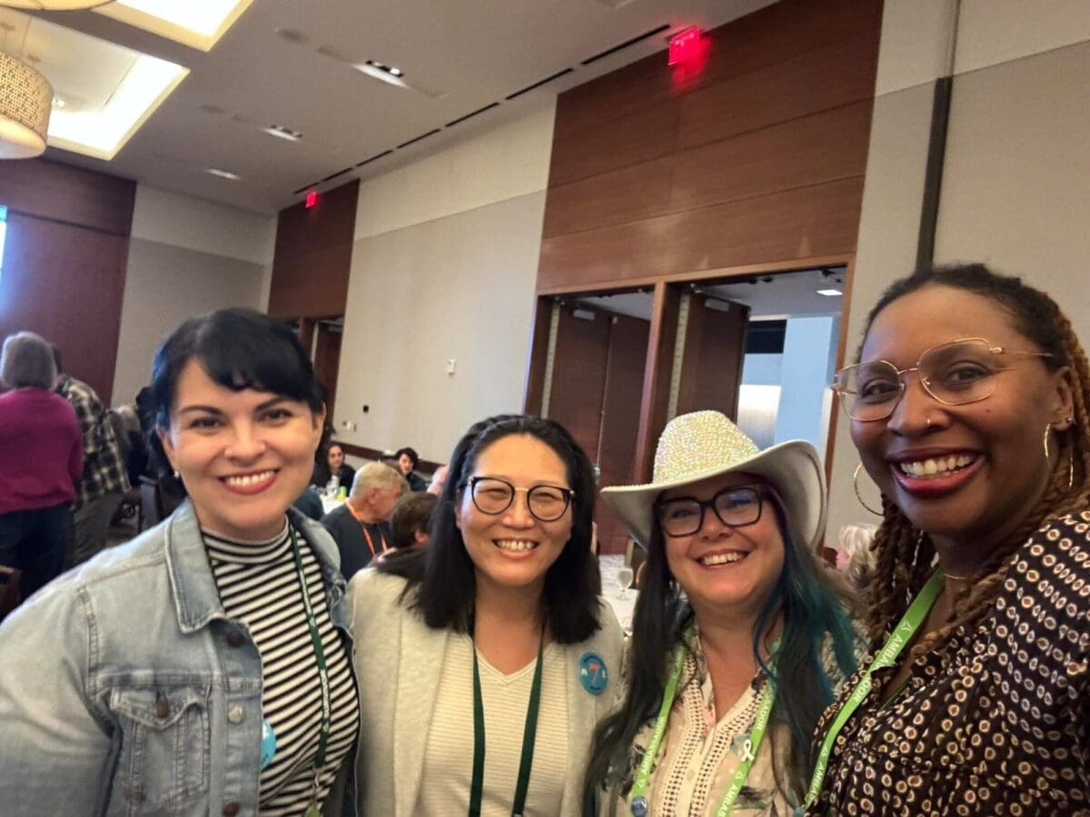 Four young lung cancer community members smiling together at the LUNGevity Hope Summit 2026 in Dallas, Texas.