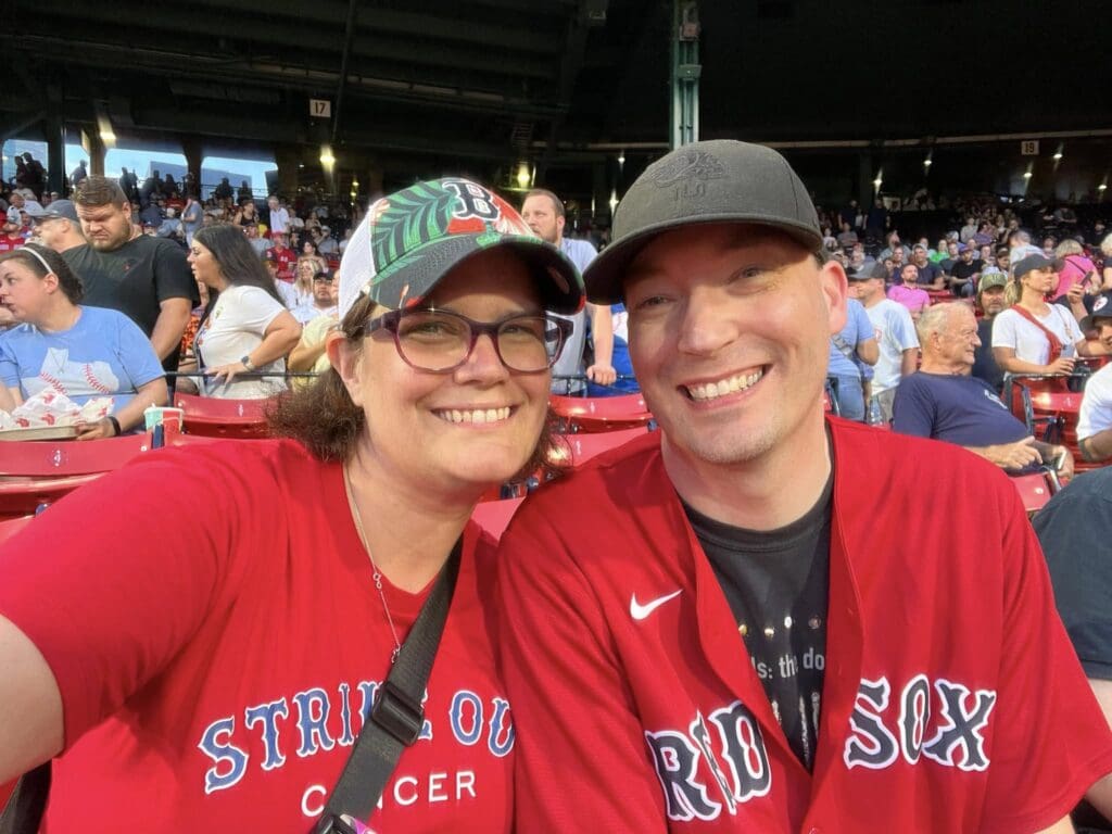 Theresa and husband smile at Fenway Park