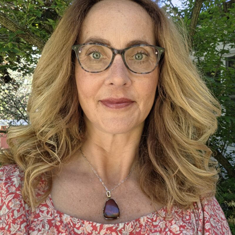 Lung cancer patient posing outdoors wearing glasses