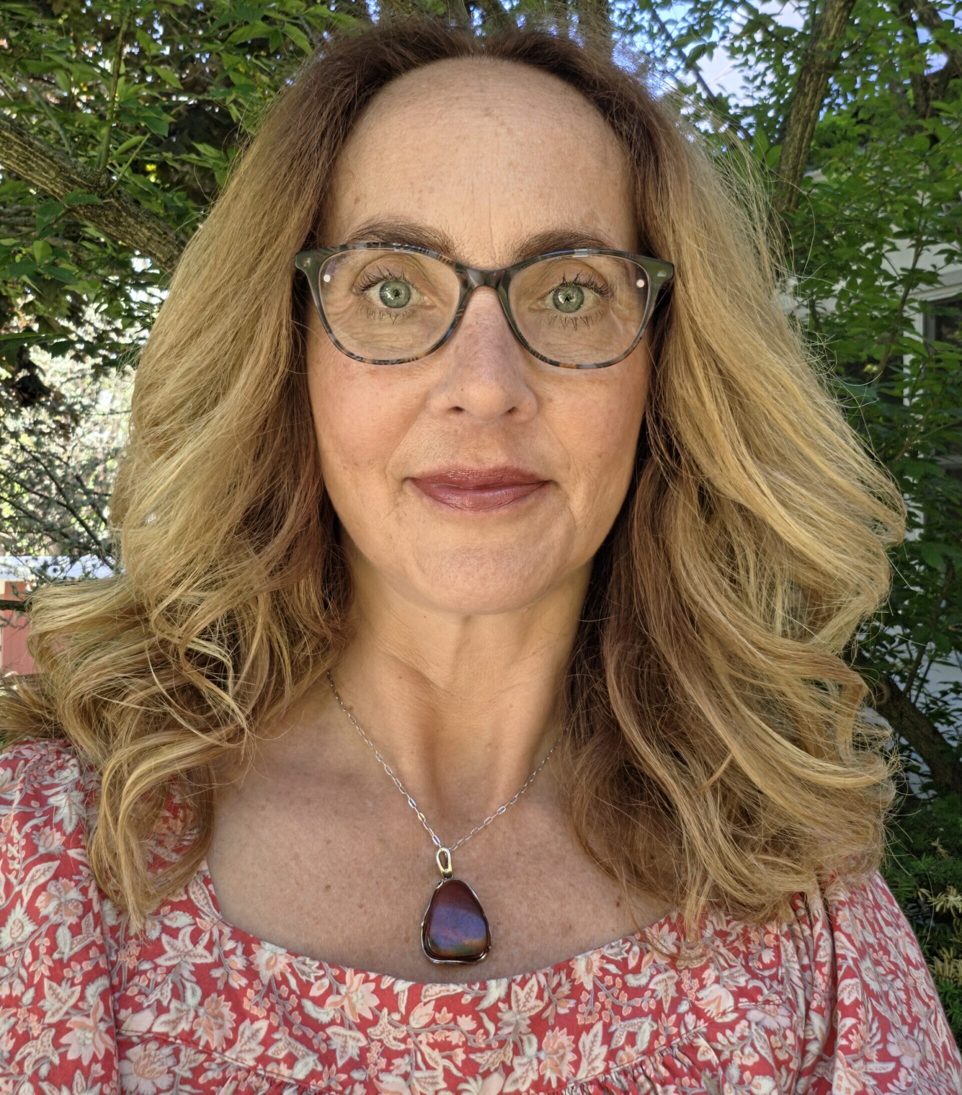 Lung cancer patient posing outdoors wearing glasses