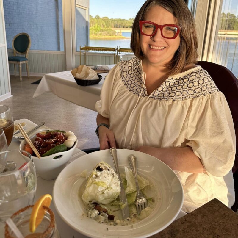 Young lung cancer patient smiling at dinner
