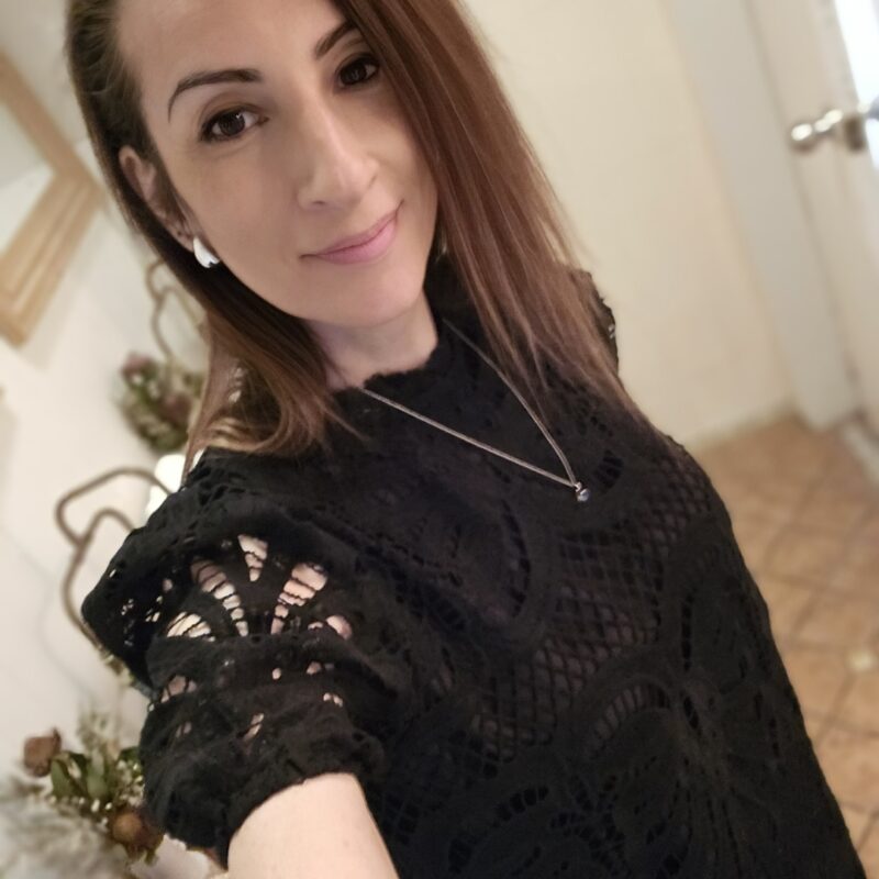 Young lung cancer patient smiling in a black top