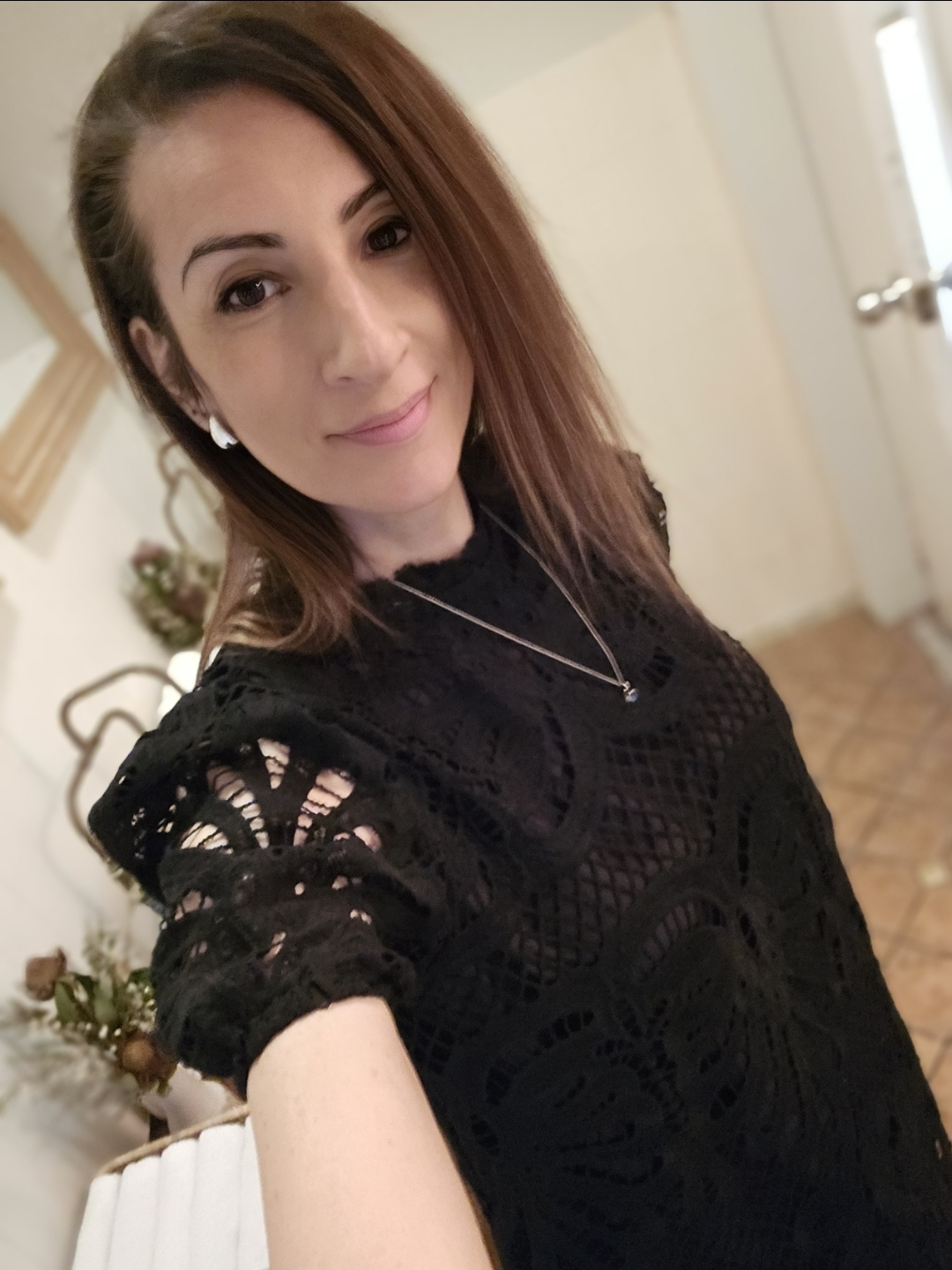 Young lung cancer patient smiling in a black top