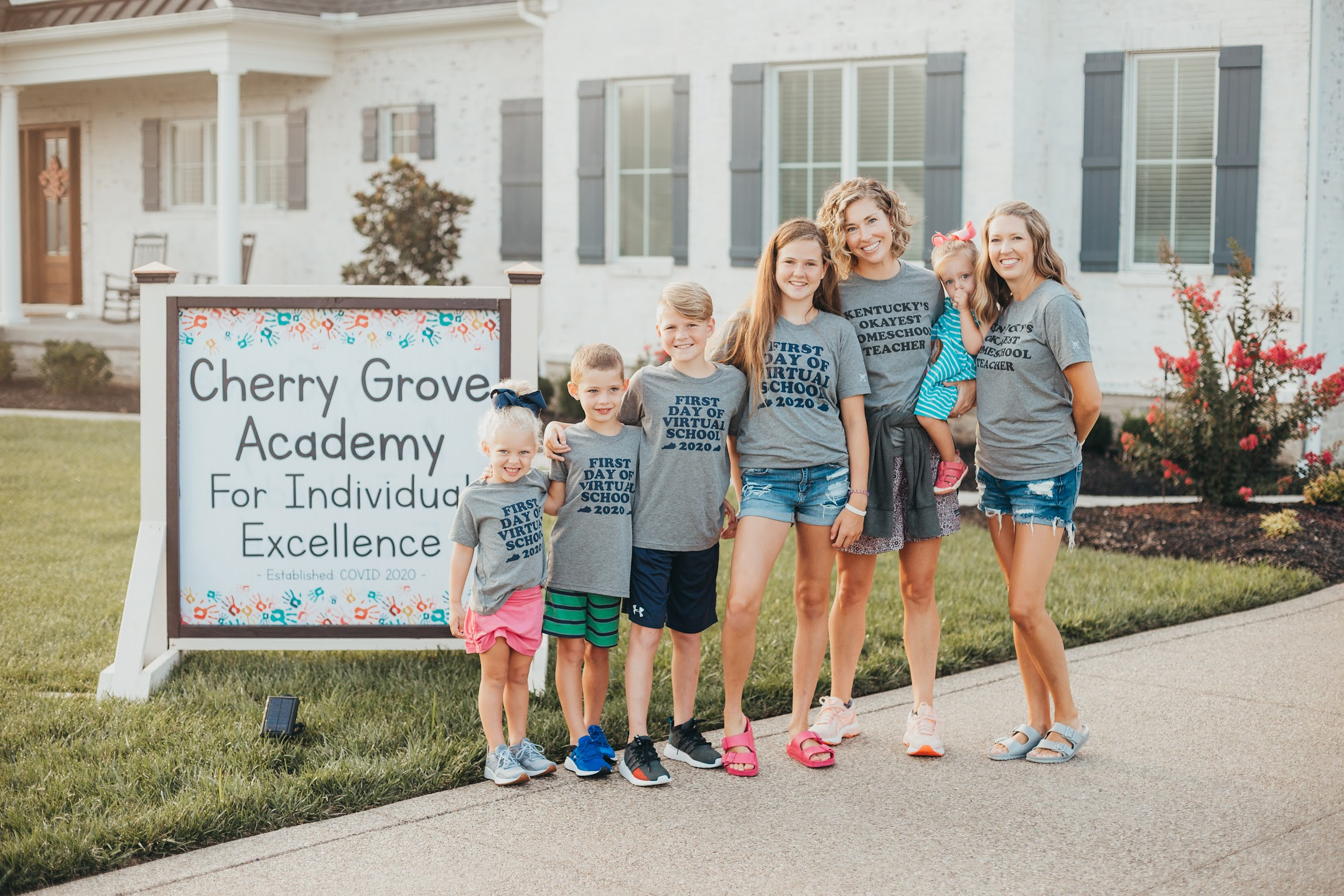 Leah with her children outside Cherry Grove Academy on the first day of virtual school in 2020