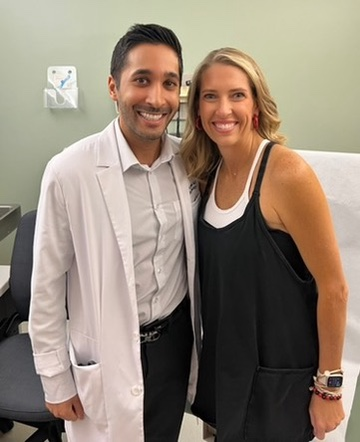 Leah with a healthcare professional in a medical office