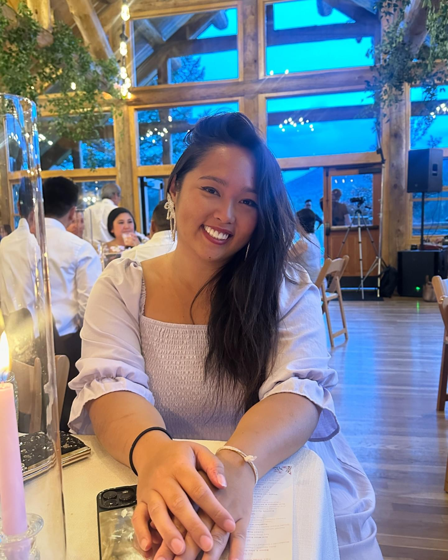 Aurora Lucas smiling while seated indoors.
